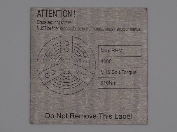 Label with safety instructions and specifications, including a caution symbol and details.