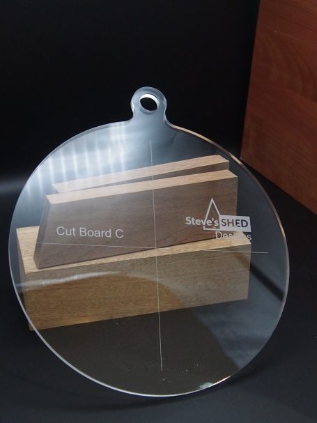 Clear acrylic cutting/Charcuterie board jig with a heart shaped hole at the top and engraved markings